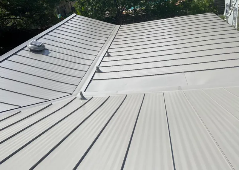 Solar attic fan installed on a metal roof for Roof Ventilation in West Hollywood
